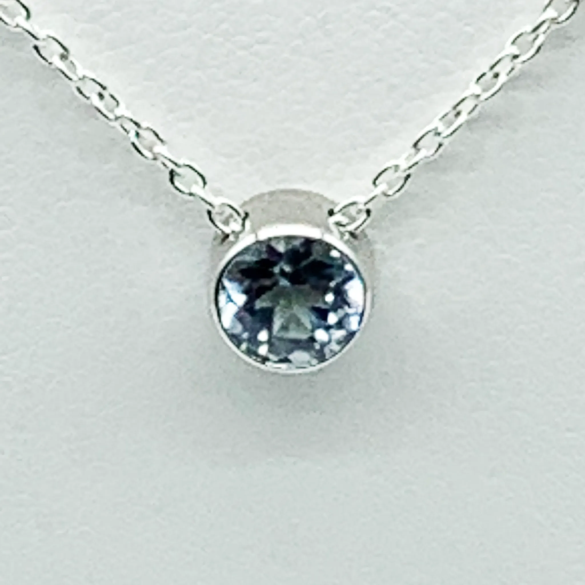 CA Parthenia Silver (Rhodium) White Gold Plated and CZ Aquamarine Diamond Cut Pendant