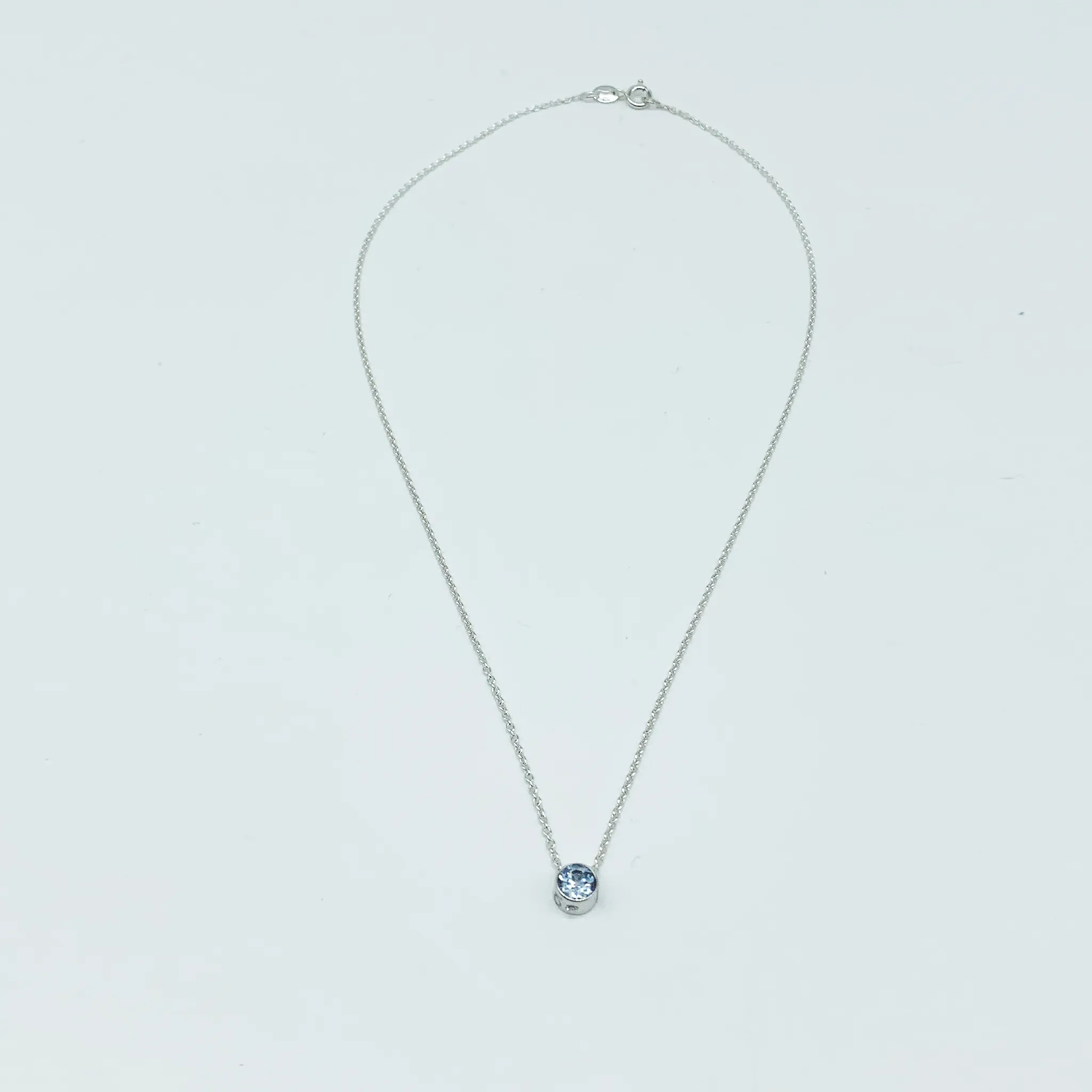 CA Parthenia Silver (Rhodium) White Gold Plated and CZ Aquamarine Diamond Cut Pendant