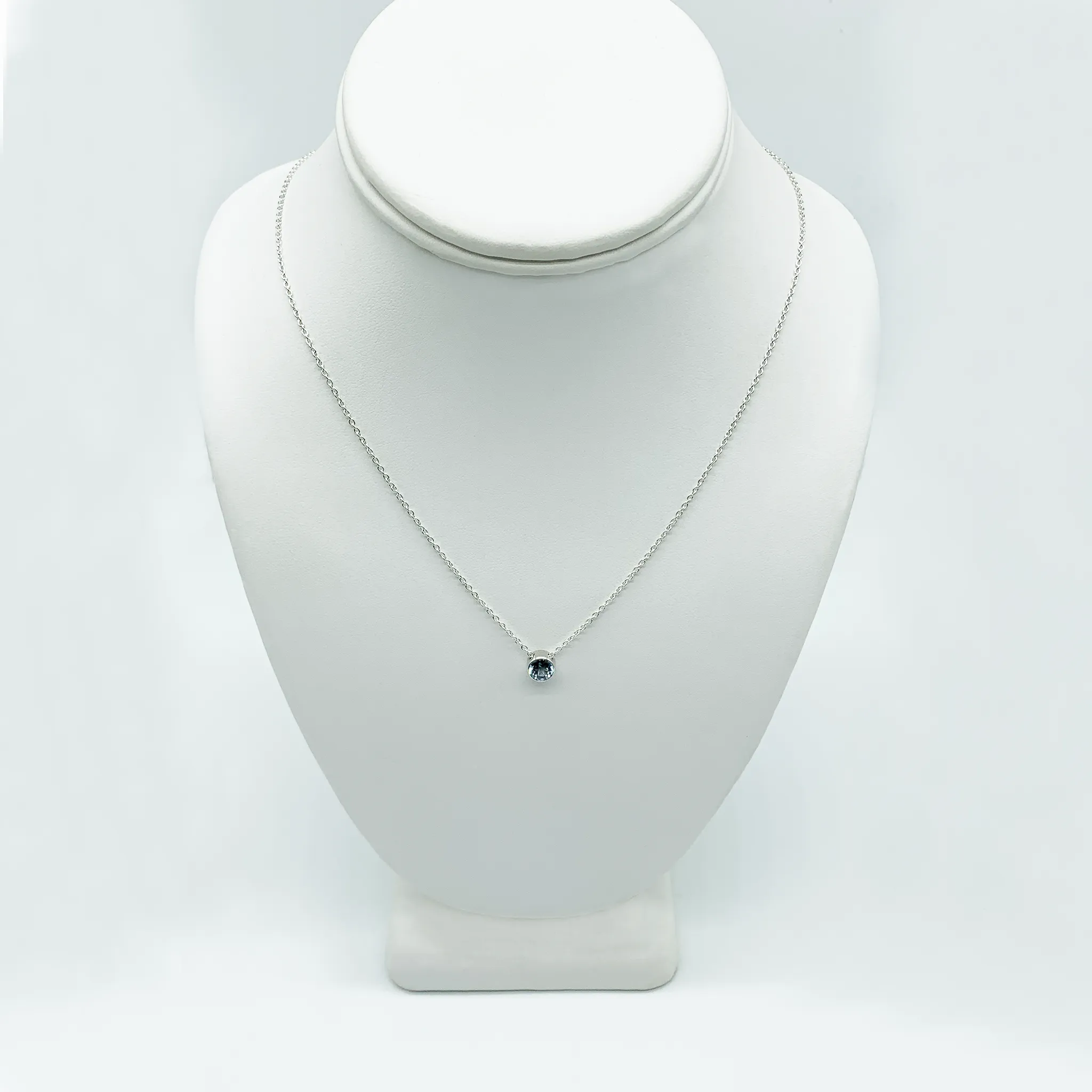 CA Parthenia Silver (Rhodium) White Gold Plated and CZ Aquamarine Diamond Cut Pendant