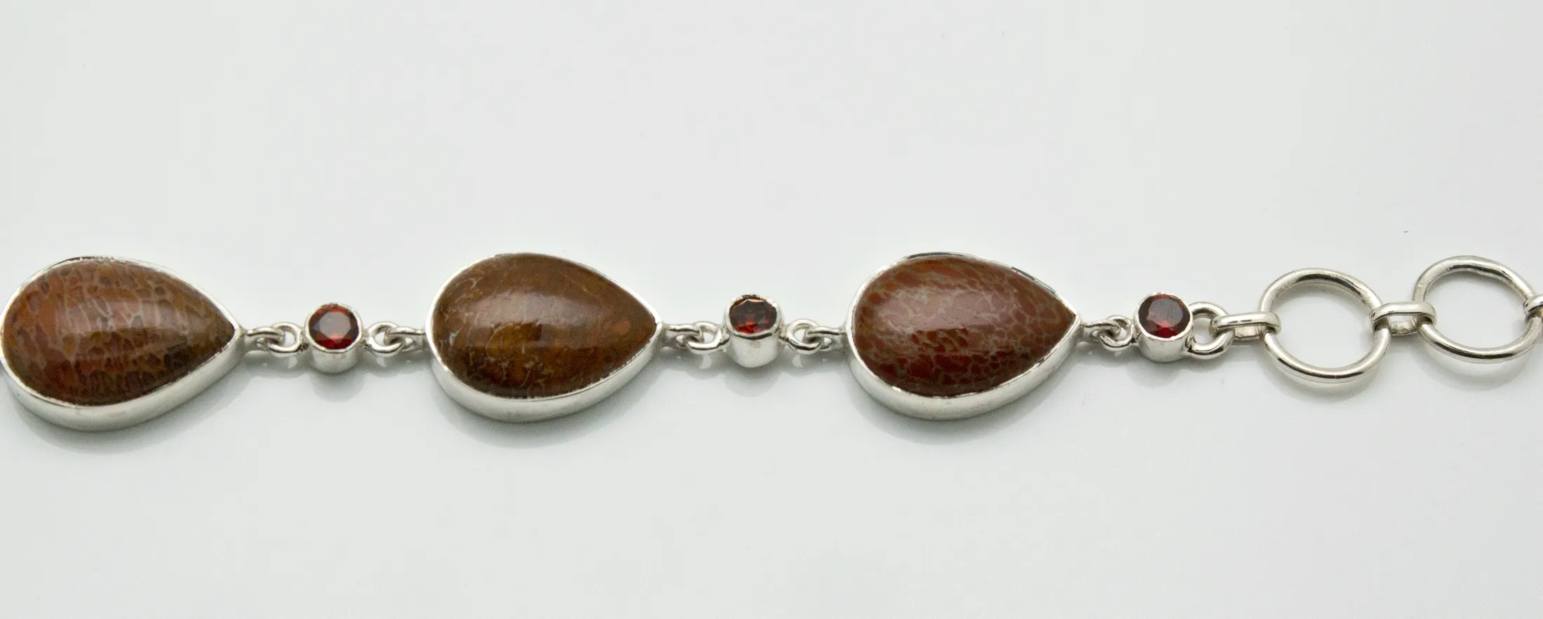 Sterling Silver Fossilized Dinosaur Bone and Garnet Bracelet