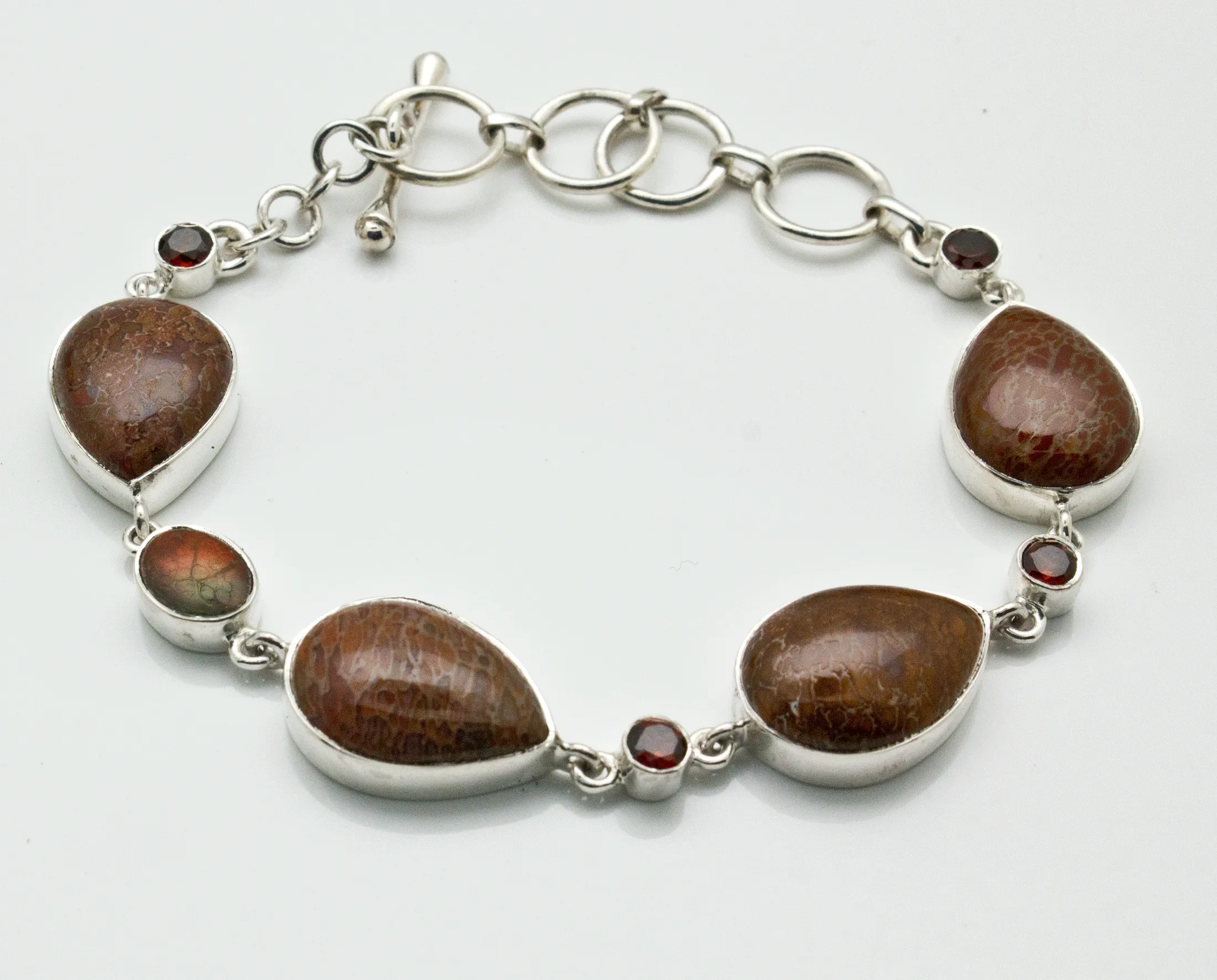 Sterling Silver Fossilized Dinosaur Bone and Garnet Bracelet