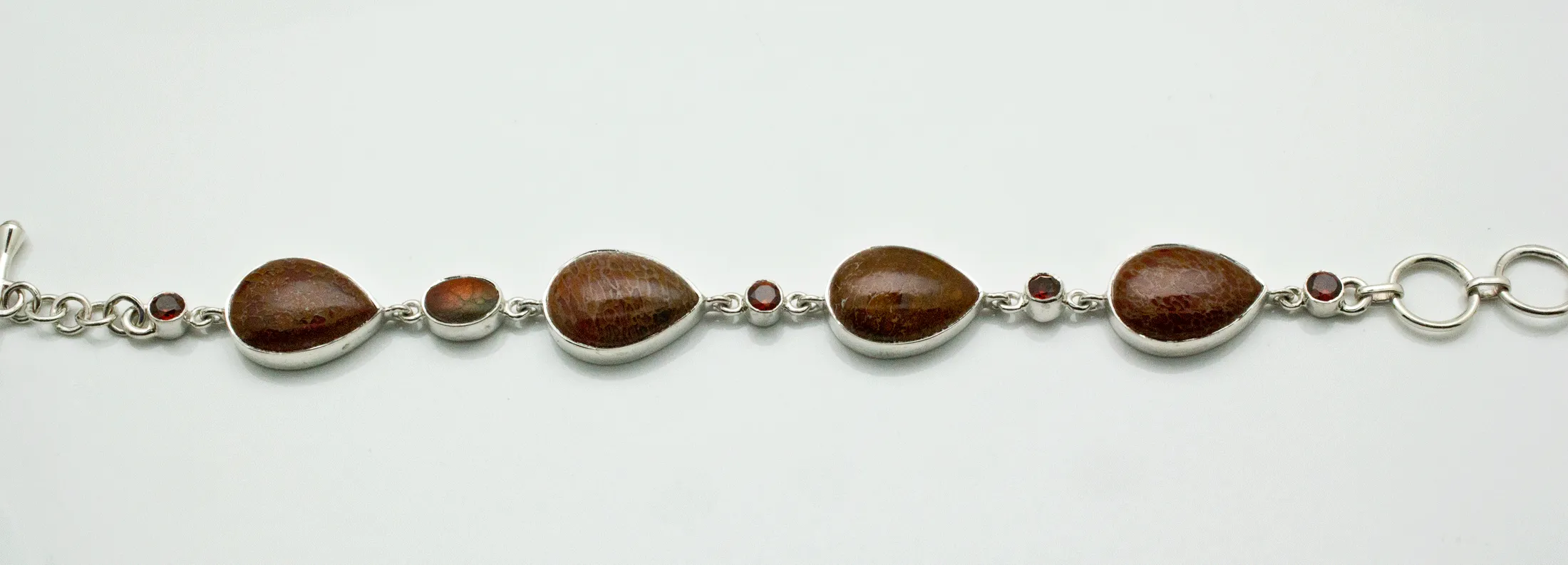 Sterling Silver Fossilized Dinosaur Bone and Garnet Bracelet
