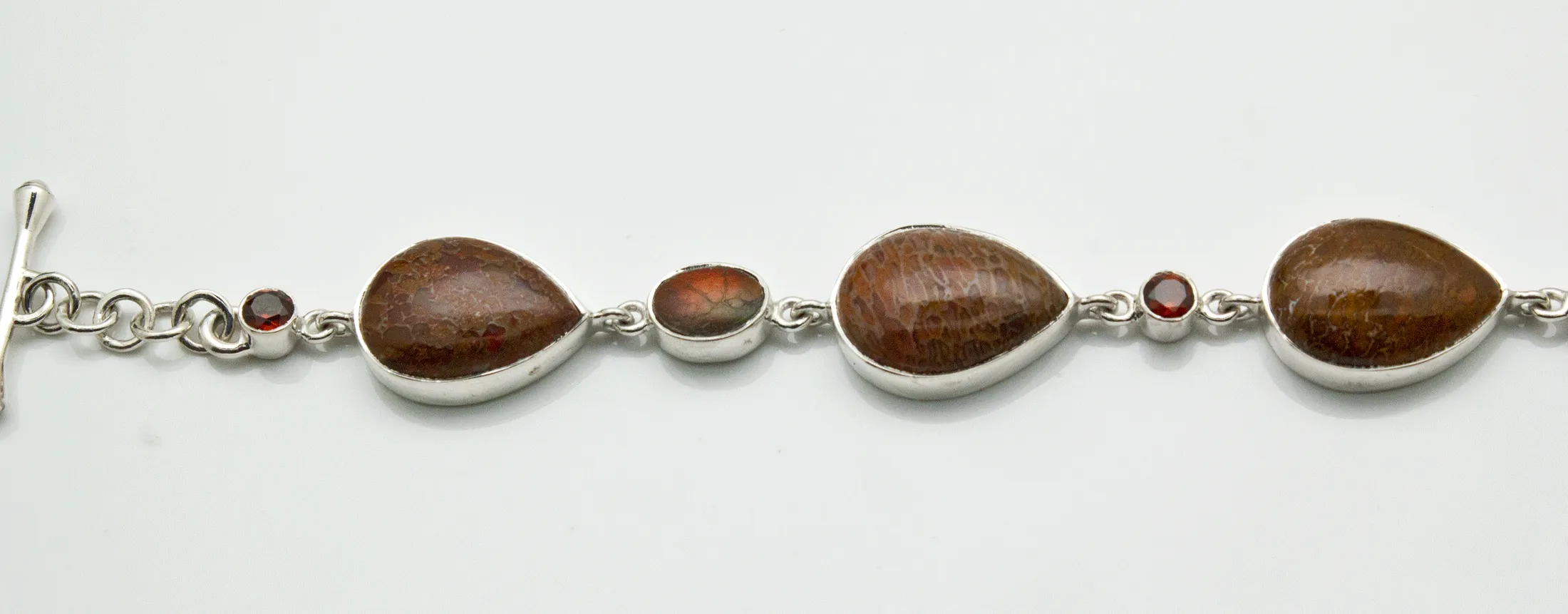 Sterling Silver Fossilized Dinosaur Bone and Garnet Bracelet